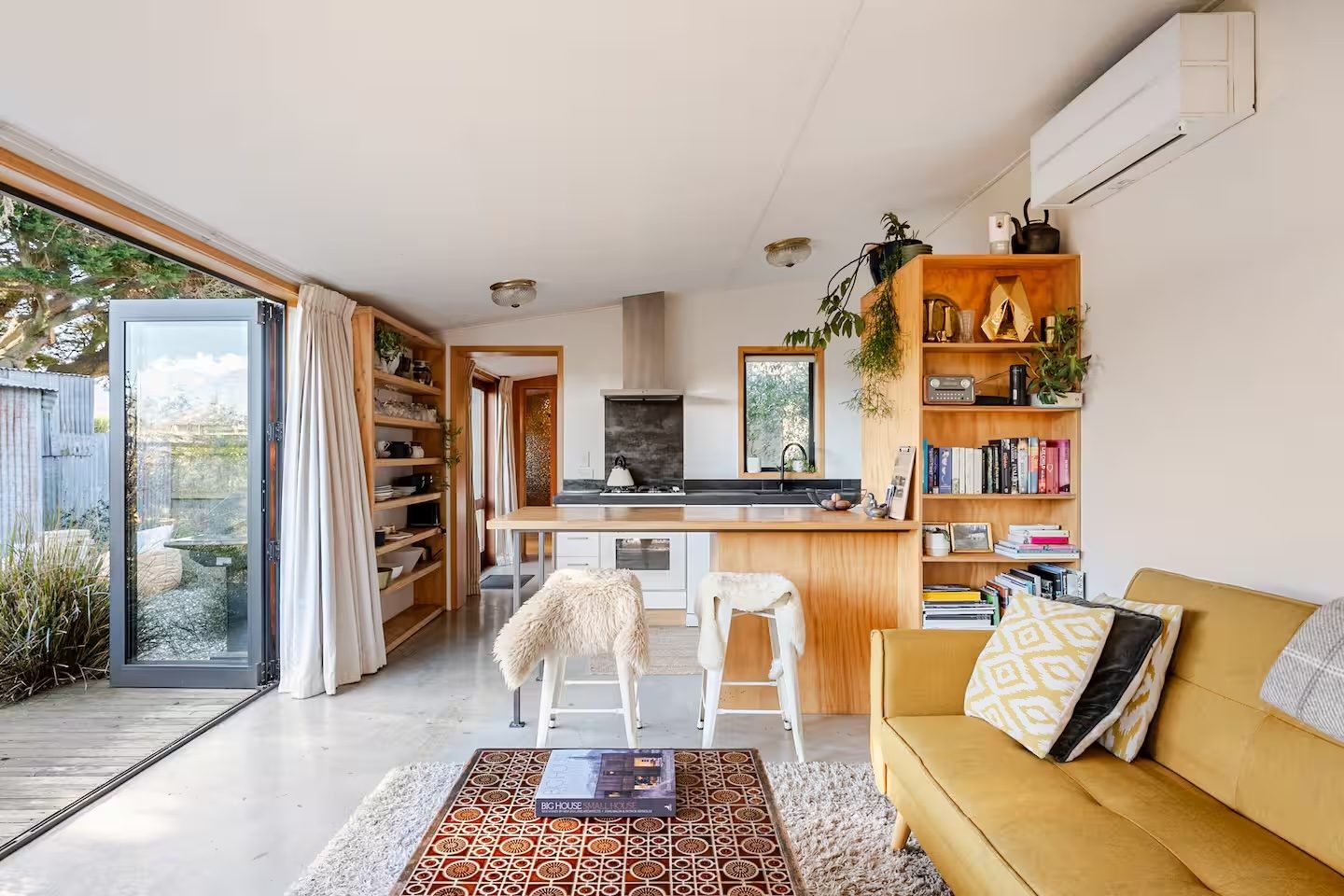Barn 8, living room with kitchen bookshelf